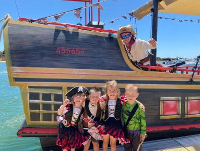 Cute kids in front of the pirate ship